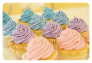 close view of brightly-colored frosted cupcakes