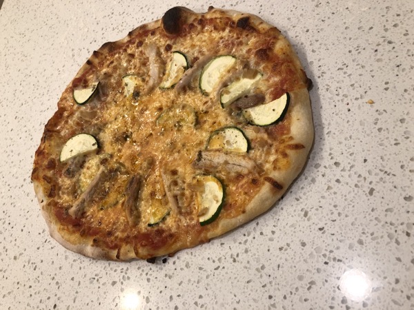 A pizza with chicken