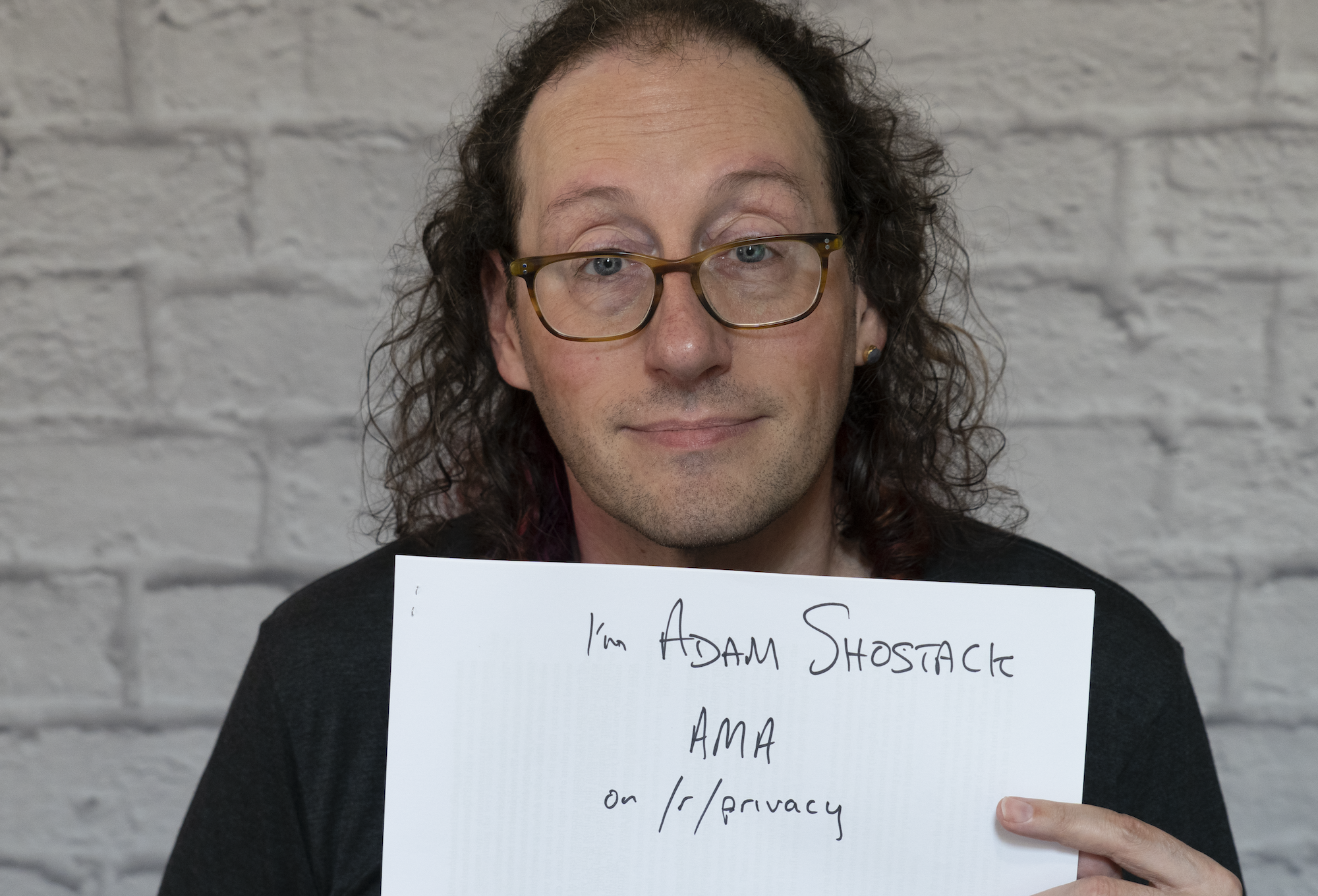 Adam holding a reddit AMA sign