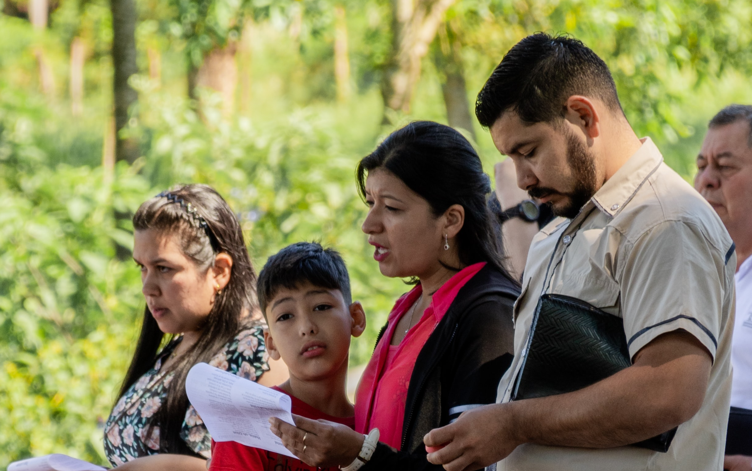 Four people reading at a church