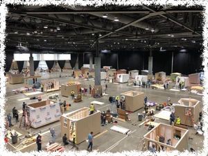 warehouse with many micro houses in various stages of completion