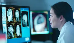 A woman studying a medical image