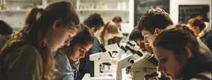 People staring into microscopes