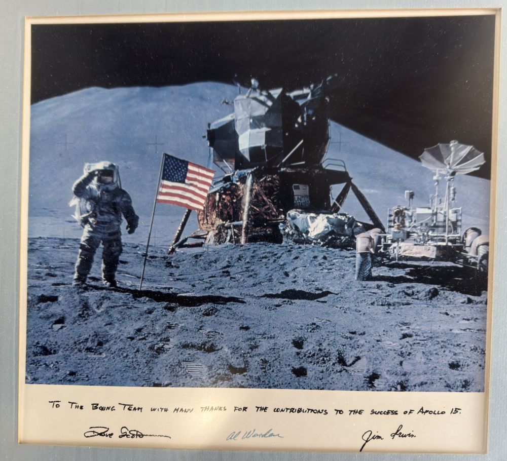 Astronaut Jim Irwin in front of Apollo 15 and a moon rover