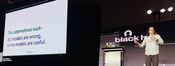 Adam on stage at Black Hat 2026. The slide reads: All models are wrong, some models are useful