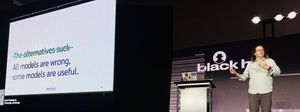 Adam on stage at Black Hat 2026. The slide reads: All models are wrong, some models are useful